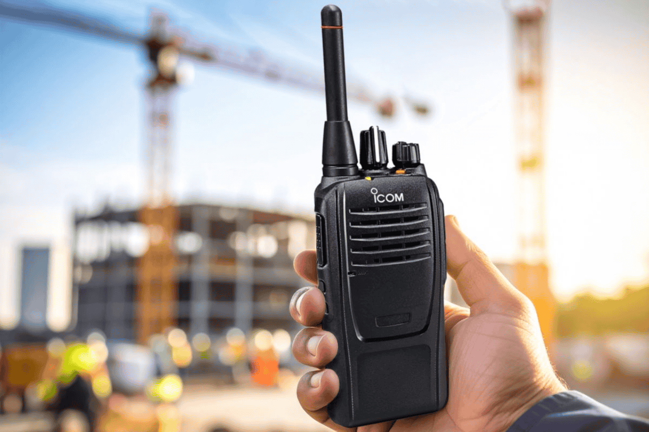 Construction crews coordinating walkie talkies on site in Malaysia